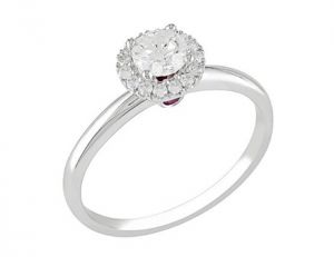 Round-cut diamond ring with .06-carat pink sapphire in 14-karat white gold.jpg